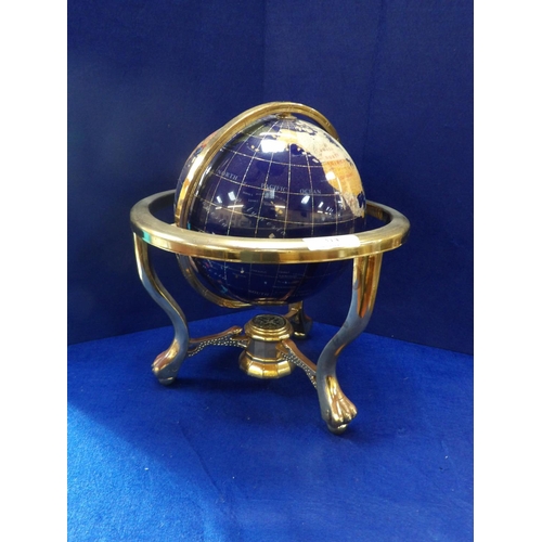 314 - A semi precious stone globe of the world mounted within a gold tone gimbal stand