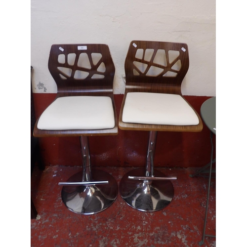 321 - A pair of modernist adjustable breakfast stools