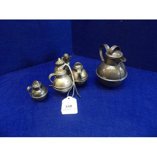 350 - A silver plated cruet modelled in the form of milk churns on a golfing themed stand together with tw... 