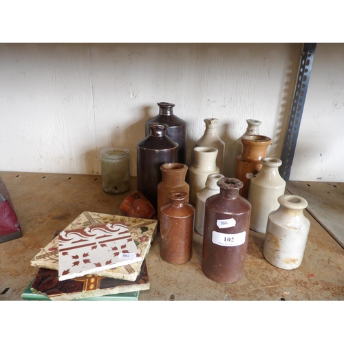 102 - An accumulation of vintage salt glazed stone ware bottles and jars together with several vintage cer... 