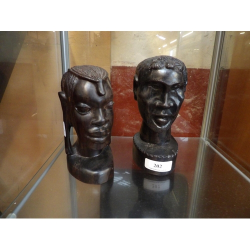 202 - A pair of carved hard wood ethnic busts