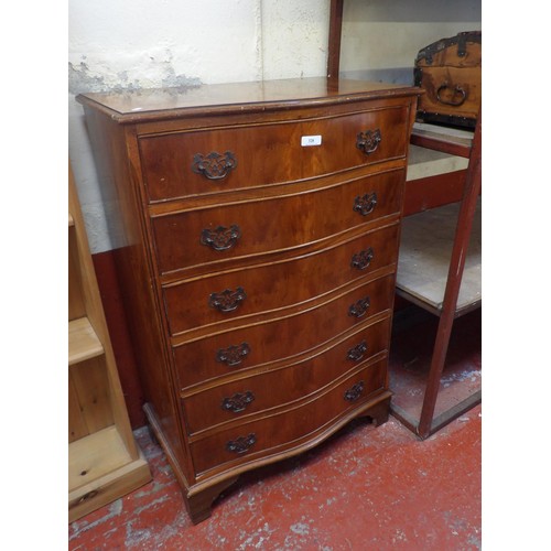 328 - A yew wood serpentine chest of six reverse graduated drawers