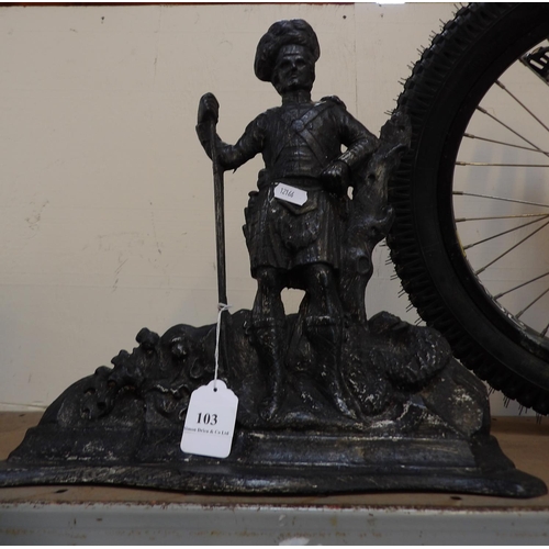 103 - A cast iron door stop modelled in the form of a Scottish Laird