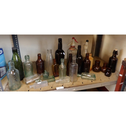 111 - An accumulation of vintage bottles