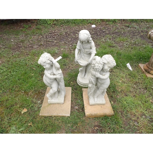 16 - Three reconstituted stone garden models, two of cupids the other of a woman