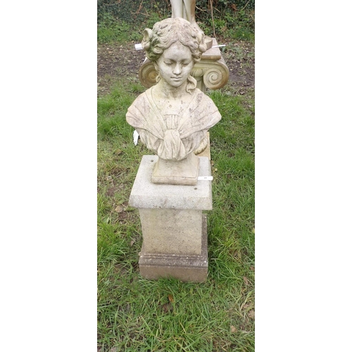 18 - A reconstituted stone bust of a woman on plinth