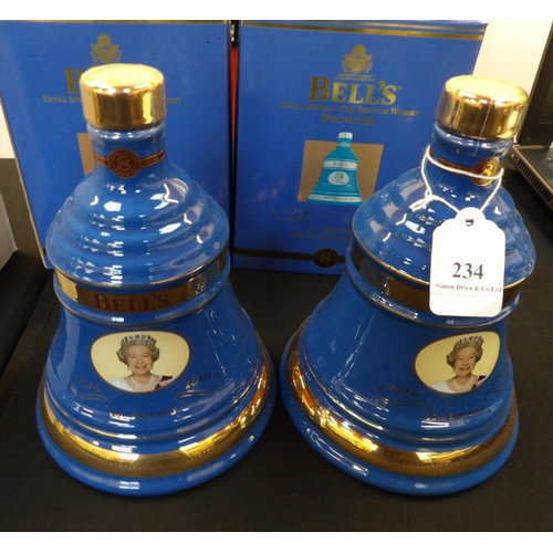 234 - Two Bell's commemorative whisky decanters 