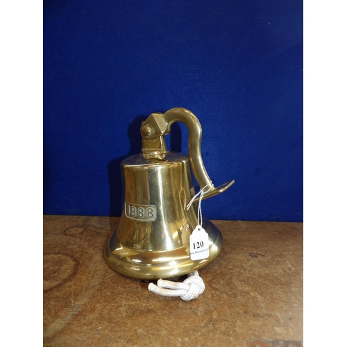 120 - A brass ship's bell complete with wall mounting