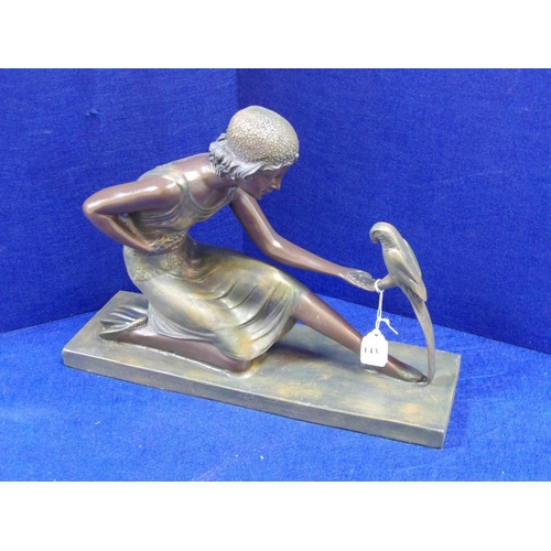 143 - A figure of an Art Nouveau woman with parakeet