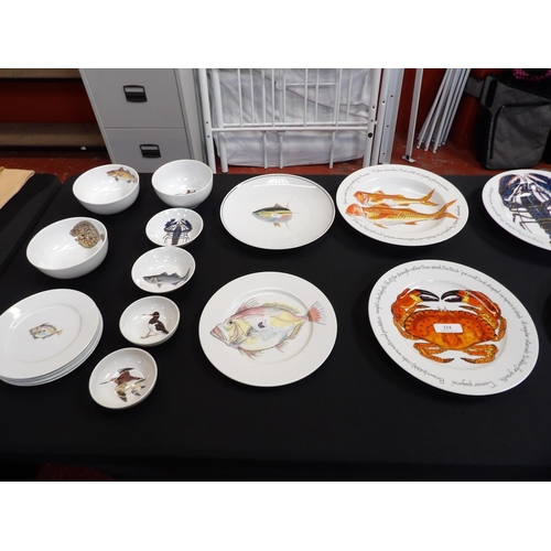 214 - A range of Richard Bramble Jersey Pottery plates, dishes and bowls decorated with fish and birds