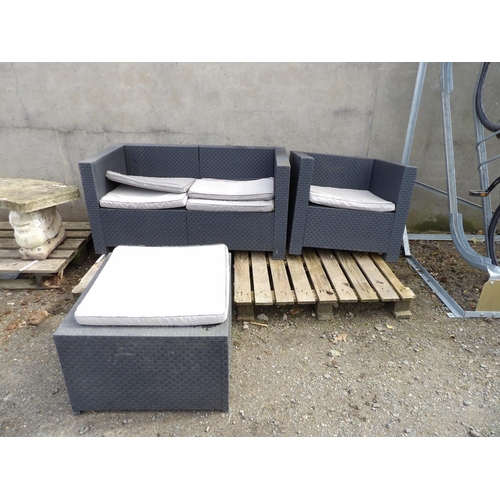 47 - An all weather rattan three piece patio suite