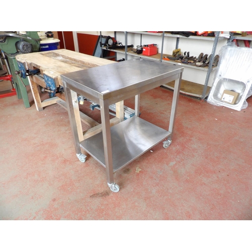 89 - A stainless steel trolley fitted an under tier