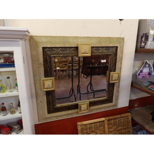 370 - A highly ornate gilt framed bevelled wall mirror