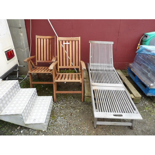 68 - A pair of teak garden chairs together with a teak sun lounger