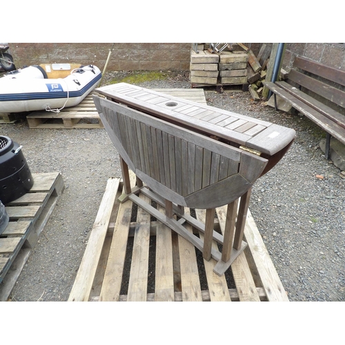 21 - A teak twin flap gate leg patio table