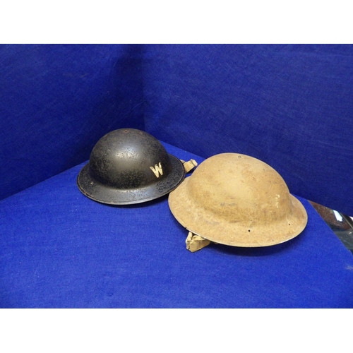 385 - Two World War II helmets