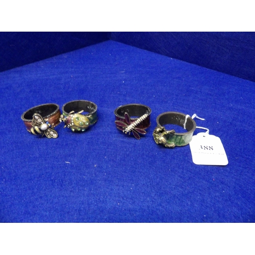 388 - Four enamelled Jay Strongwater napkin rings