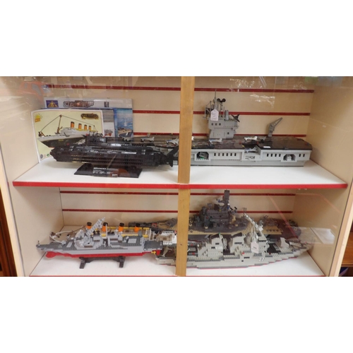 295 - A collection of model warships, an aircraft carrier, a submarine and the Titanic