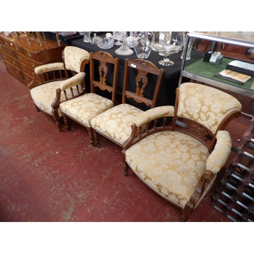 298 - A pair of Edwardian Walnut armchairs and matching side chairs upholstered in gold coloured flock des... 