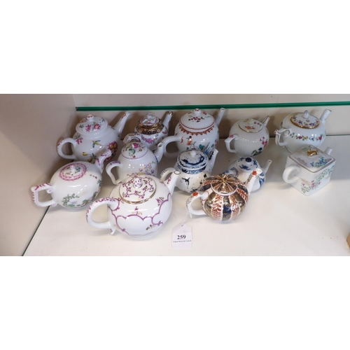 259 - A collection of ceramic teapots