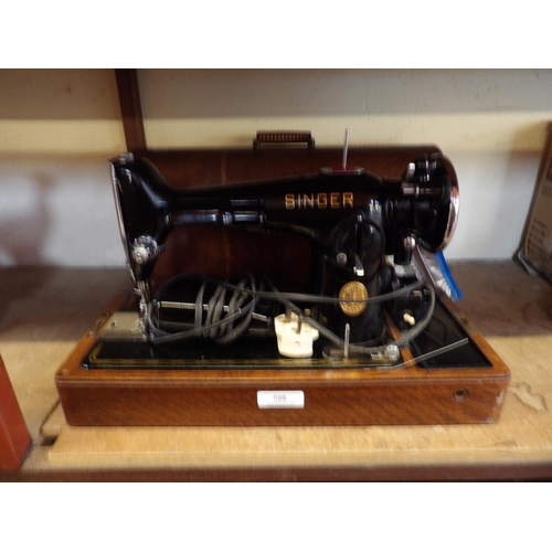 508 - A mid century Singer portable electric sewing machine