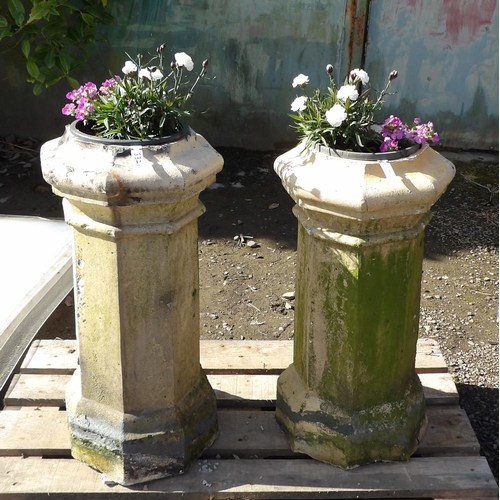 60 - A pair of vintage chimney pots now utilised as planters