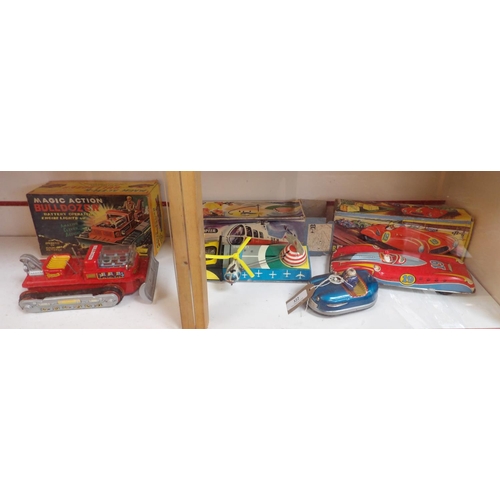 322 - Four mid century tin plate toys