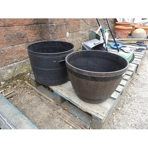 58 - Two plastic planters modeled in the form of barrels