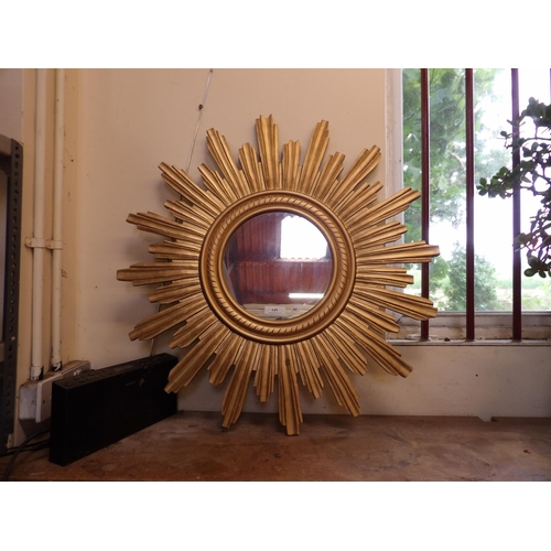 149 - A gilt framed star burst mirror