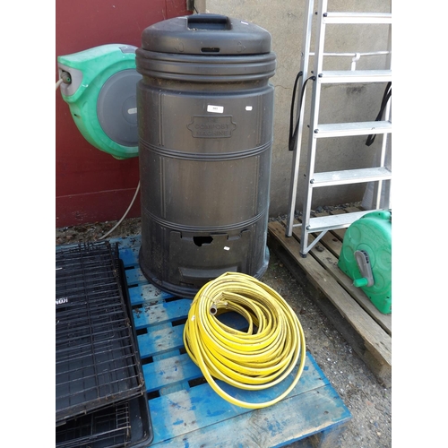 103 - A Compost Machine composting bin together with two coils of lay flat hose