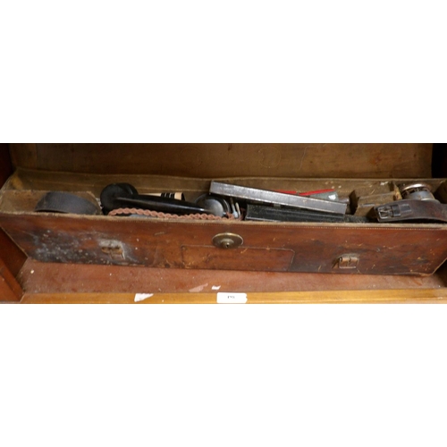 498 - A vintage leather case containing a varied assortment of militaria