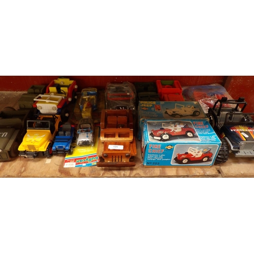 529 - Assorted toy jeeps