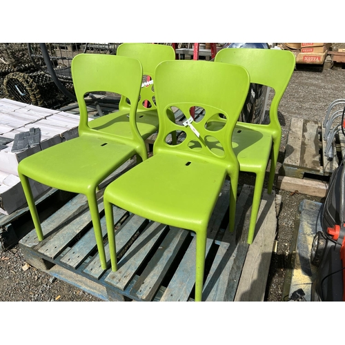 104 - A set of four green PVC chairs