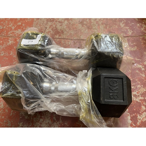 275 - A pair of 8kg dumbells - new