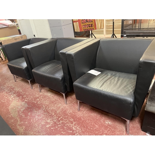 315 - A set of three contemporary armchairs upholstered in black faux leather