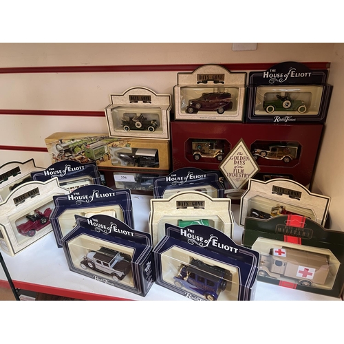 336 - A collection of boxed diecast model vehicles and horse drawn vehicles