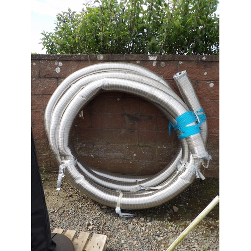 46 - A coil of stainless steel flexible chimney flue