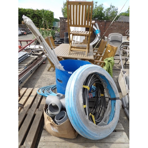 49 - Assorted rolls of water pipe, armoured electrical cable, drainage fittings etc.