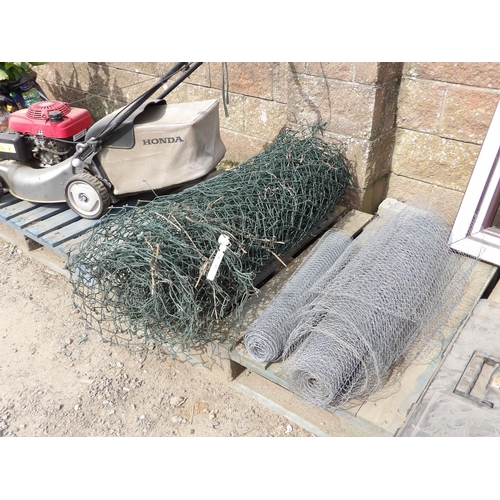 67 - A roll of chainlink fencing together with two rolls of galvanised mesh fencing