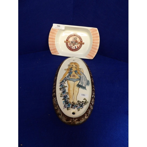 380 - A Jersey Pottery oval plaque depicting a woman together with a Jersey Pottery ashtray inscribed Jers... 