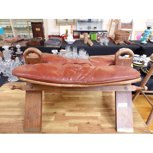 395 - A camel saddle stool