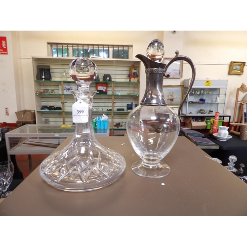 399 - A ship's decanter together with a claret jug with silver plated mounts