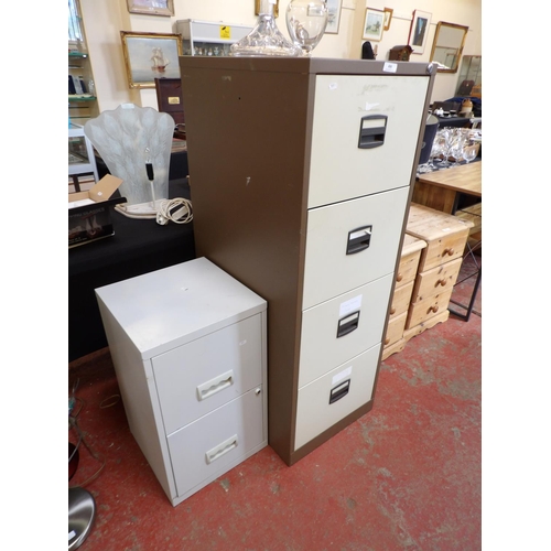 400 - A metallic four drawer filing cabinet together with a metallic two drawer filing cabinet