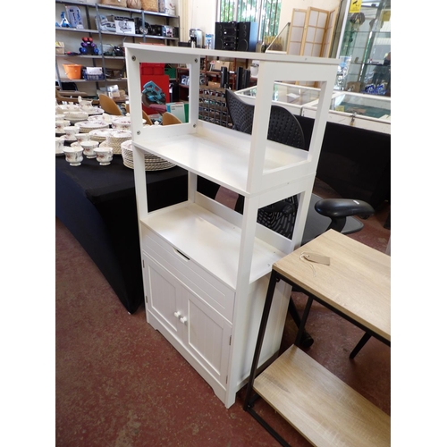 413 - A three tier shelf unit fitted a drawer and two doors below