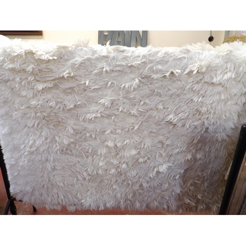 421 - A Polar Shaggy ivory coloured deep pile floor rug (160 x 230cm)