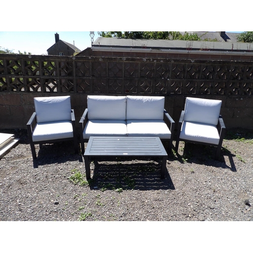 32 - An outdoor patio suite consisting of a two seater settee, two armchairs and a coffee table