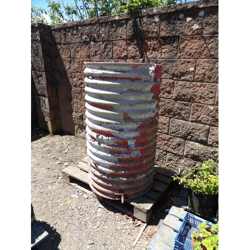 56 - A corrugated galvanised circular water butt