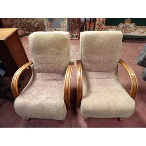 343 - A pair of Art Deco open rocking chairs upholstered in floral design fabric