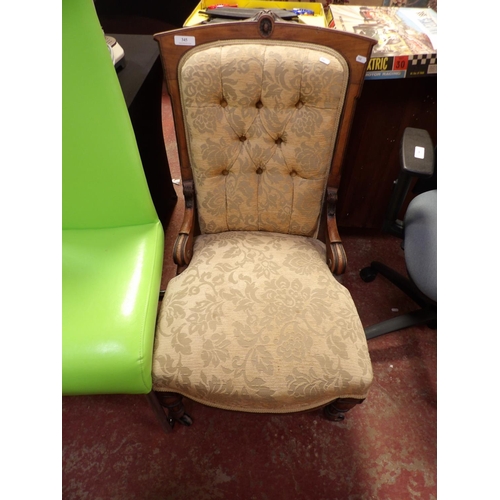 345 - A late Victorian mahogany nursing chair upholstered in flock design fabric