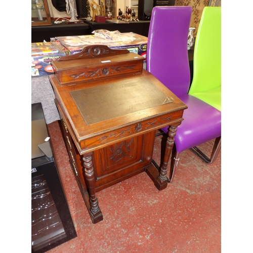 347 - A late Victorian walnut Canterbury